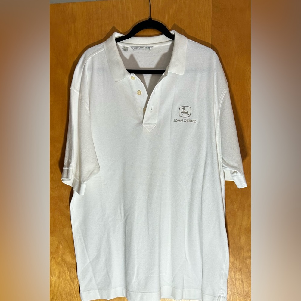 NWOT XL John Deere white polo with silver embroidered emblem.